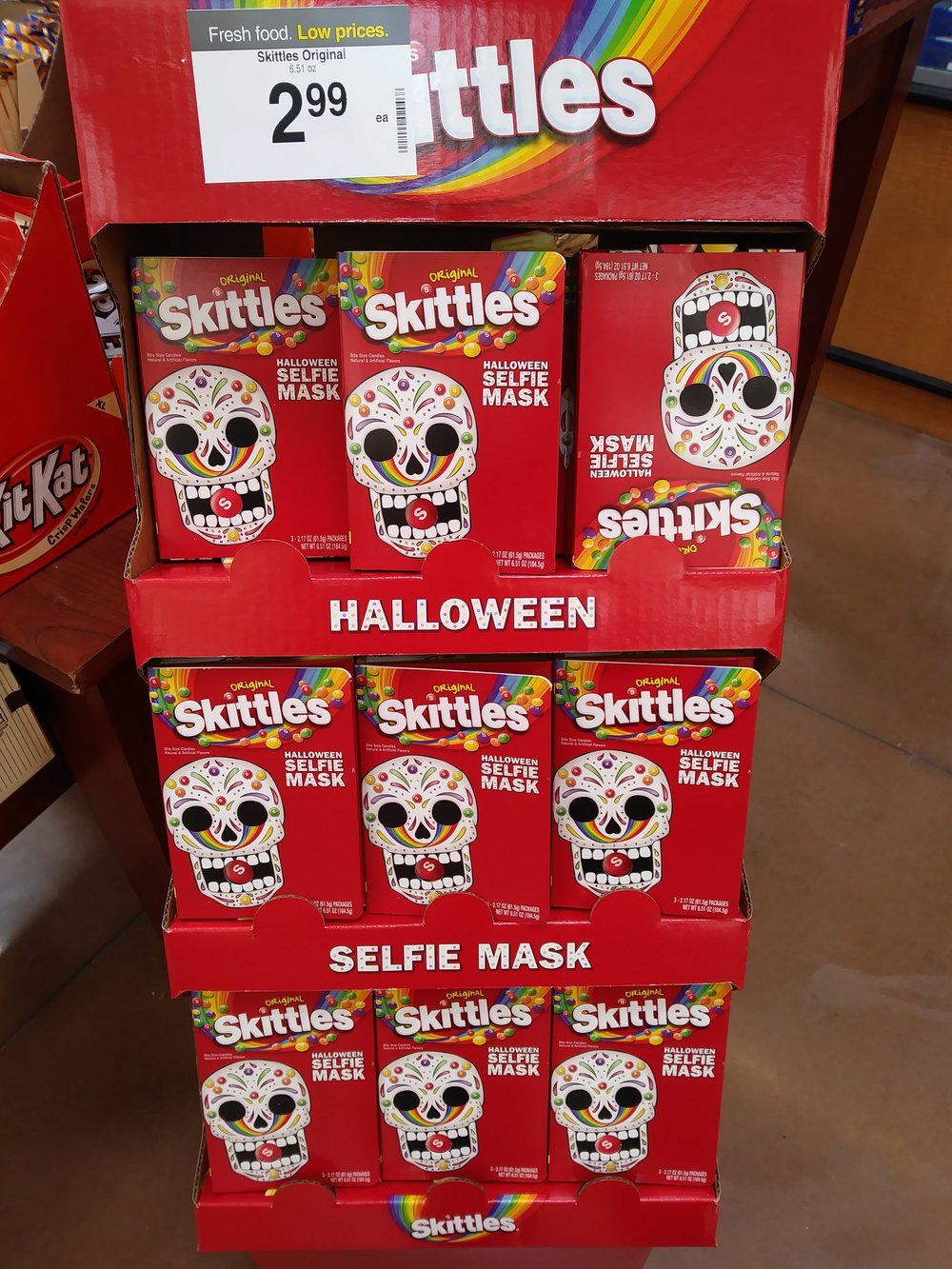 An of Skittles at a store.