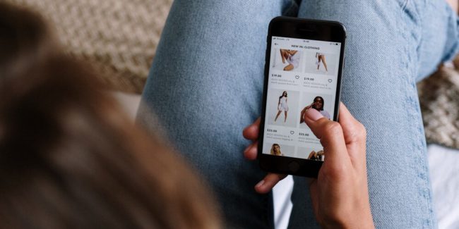 image of someone using shoppable social on a phone - expanded shopping features for Instagram