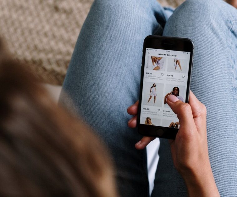 image of someone using shoppable social on a phone - expanded shopping features for Instagram