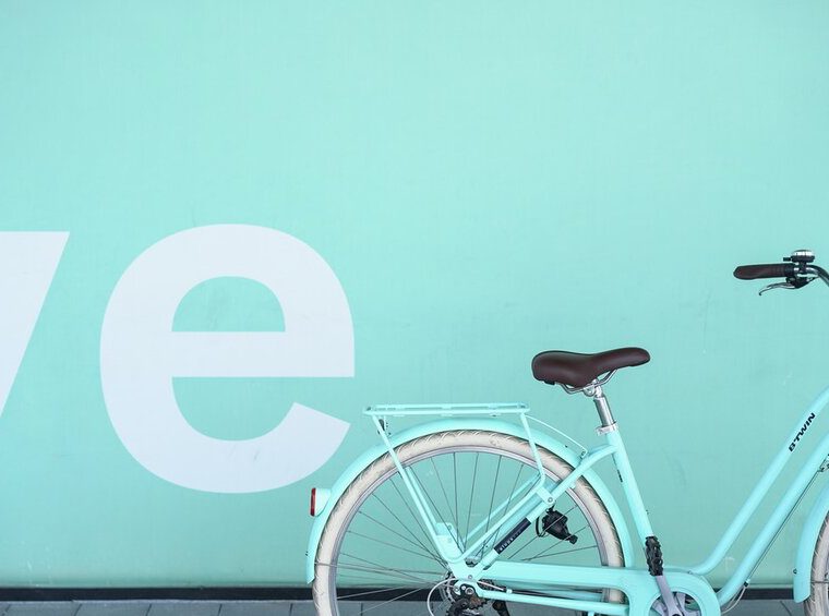 pic of bicycle against teal background - IG posts reach