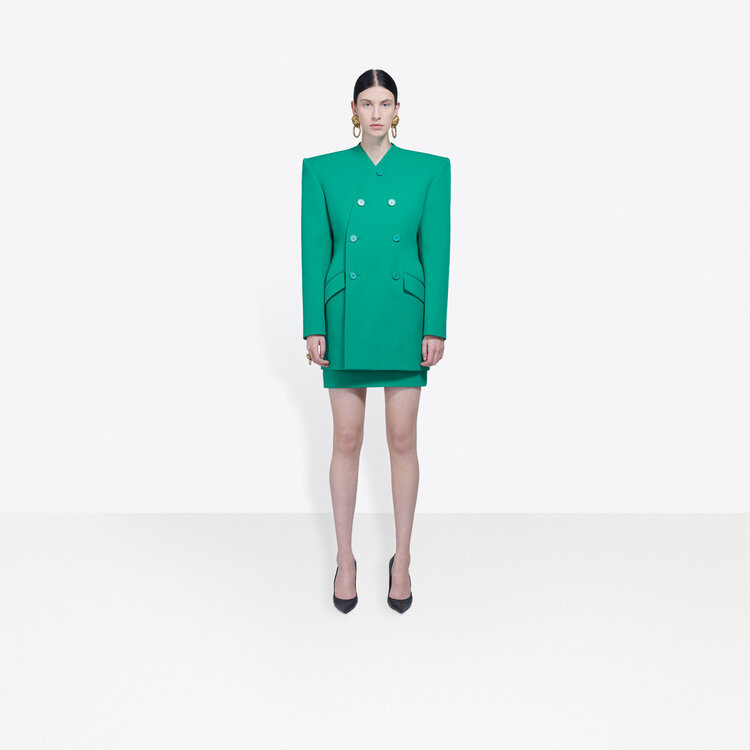  woman wearing green Balenciaga blazer and skirt .jpg