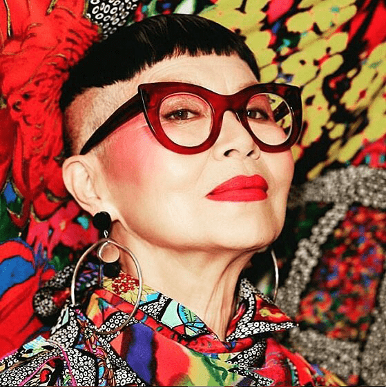 colorful close-up pic of over-50 creative influencer Jenny Kee in glasses