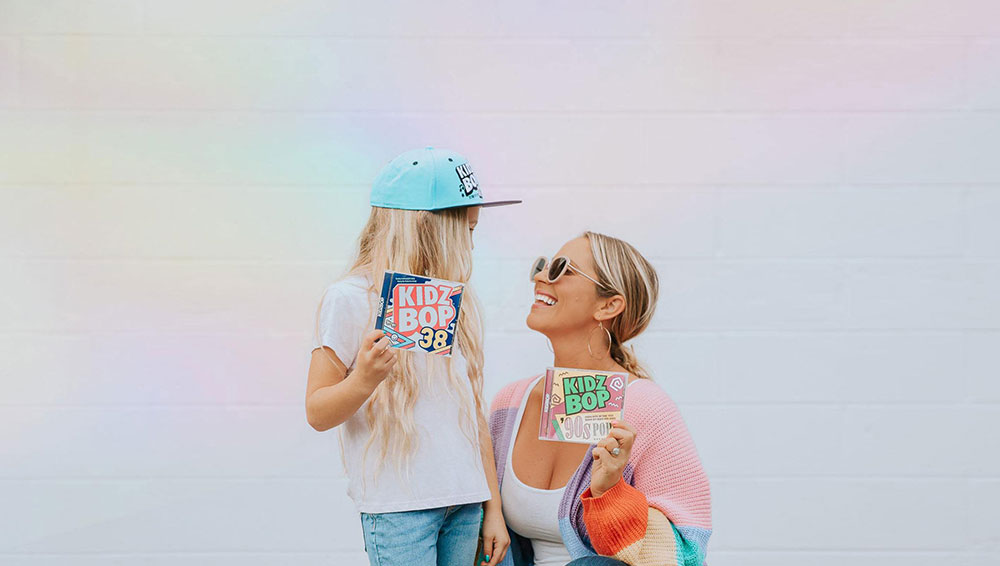 Mom and daughter holding up cd's for KIDZ BOP influencer campaign