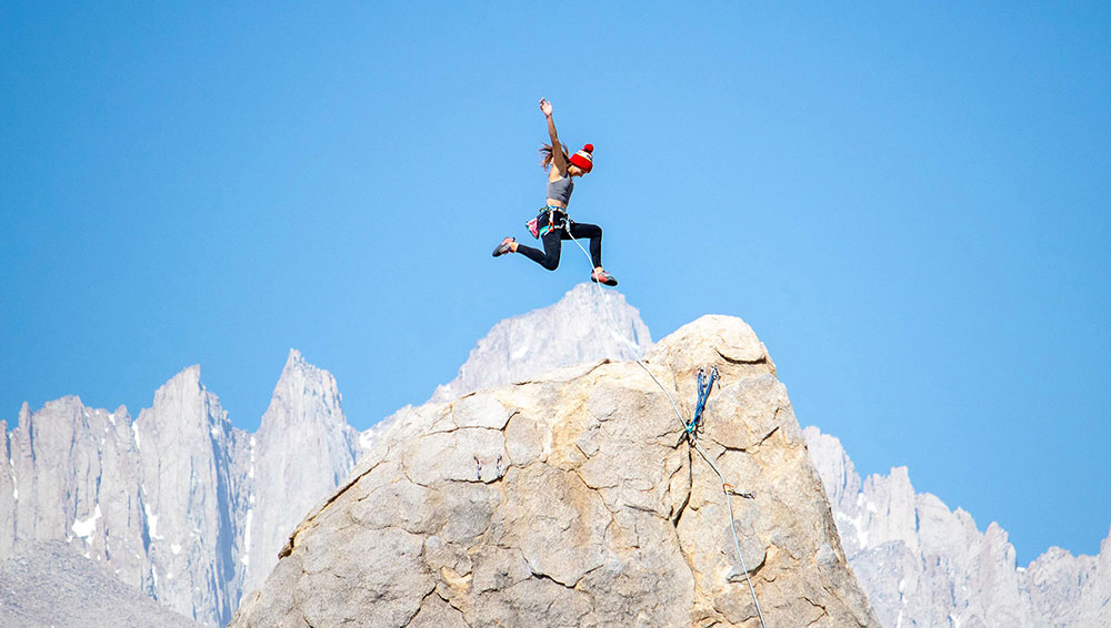 Woman on top of a mountain for Moosejaw influencer campaign