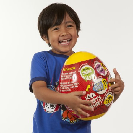An image of a kid holding Ryan’s World Giant Mystery Egg.