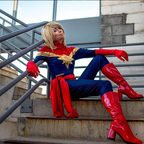 A post from @COSTUMESUPERCENTER of a captain marvel's costume.