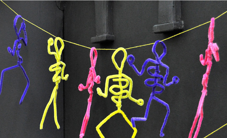 An image of few creative little pipe cleaner skeletons.